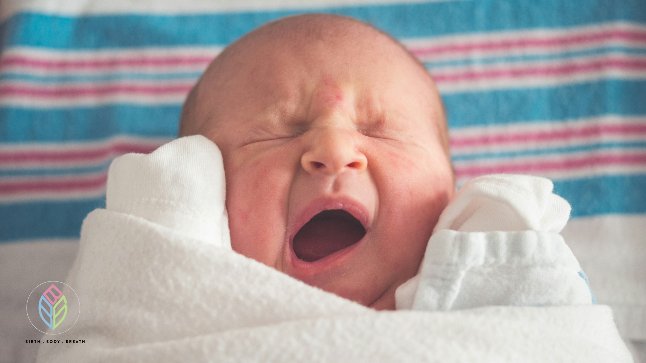 Newborn baby wrapped in a blanket, illustrating a positive birth story