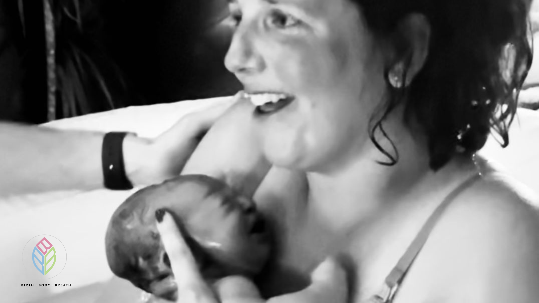 Rachel and newborn Rosa in the birth pool after a positive home birth in Bristol